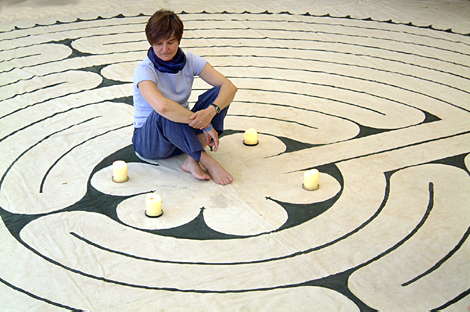 Labyrinth Society founder Helen Curry sits on her awesome canvas Chartres Labyrinth; see cover of Inner Christianity